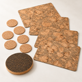 Iceberg Grey cork table set for four: four patterned cork placemats, six natural cork coasters and one dark round cork trivet — full 11-piece studio hero