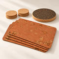 Iceberg Red Cork Table Set for four, four terracotta cork placemats, six natural cork coasters and dark round cork trivet — premium studio hero