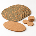 Photorealistic studio visualization of the complete CorkMart Oval Iceberg Grey 11-piece table set: four oval placemats, six round coasters and one natural oval trivet.