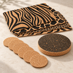 Jungle table set angled studio view showing four patterned placemats, six natural round coasters and thick dark round cork trivet