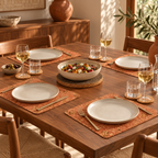 Iceberg Red cork table set in a contemporary dining room, four red cork placemats, six natural coasters and dark round trivet