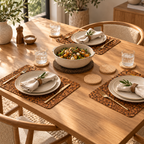 Elegant dining table featuring Samba amber-brown cork placemats with natural coasters and dark serving trivet.