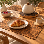Samba cork placemat with morning pastry and espresso on natural cork coaster; dark cork trivet supports a teapot.