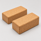 Studio display of two natural Portuguese cork yoga blocks, 227 × 120 × 75 mm each