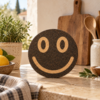 Smile Black cork trivet in a warm Mediterranean kitchen lifestyle setting