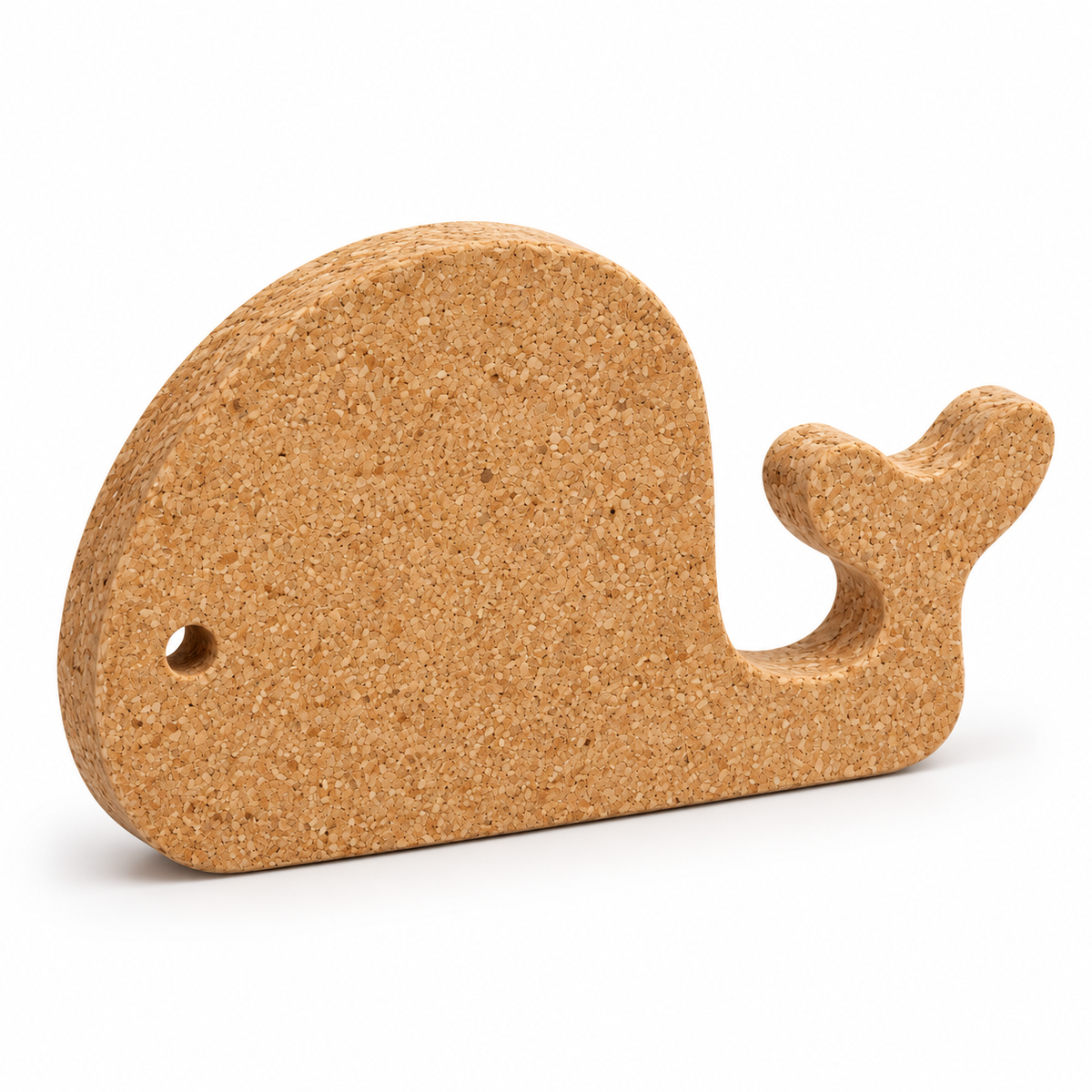 Whale-shaped natural cork trivet, 29 × 18 cm, angled view showing 20 mm thickness