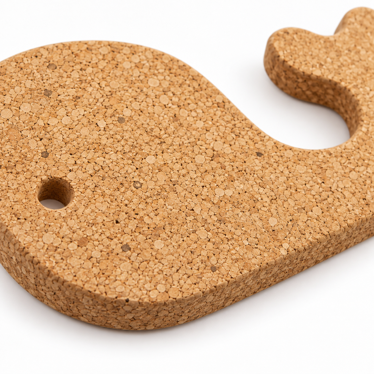 Macro detail of natural cork texture and edge on whale-shaped trivet