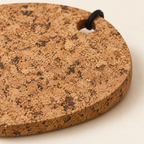 Country cork trivet - close-up of natural cork texture, 15 mm edge and hanging loop