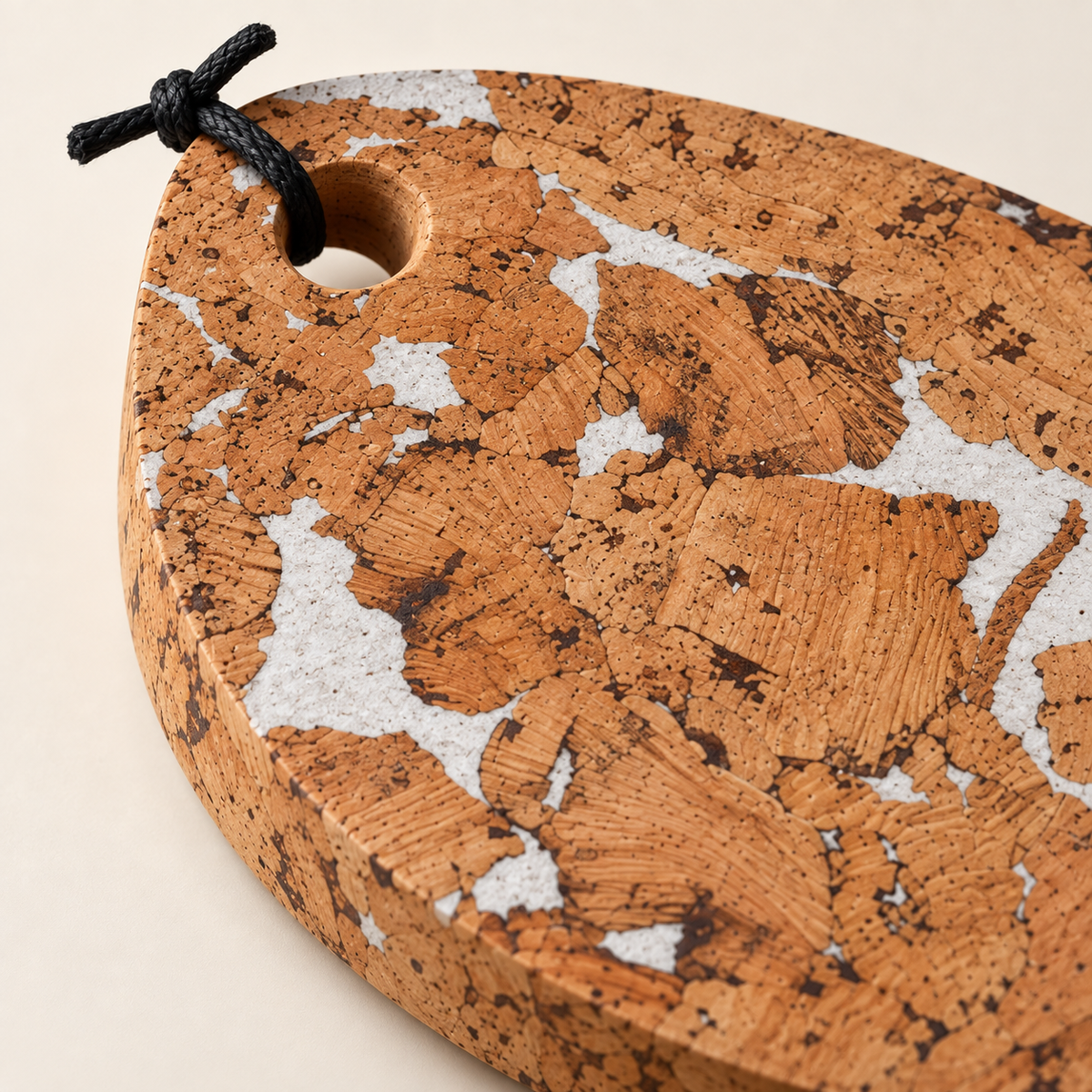 Fjord White cork trivet - close-up of cork pattern, 15 mm edge and hanging loop