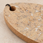 Snow White cork trivet - close-up of pale cork pattern, edge and hanging loop