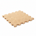 Beige interlocking foam puzzle mat on a white background