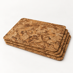 Stack of four Angola cork placemats showing thin profile and rounded corners