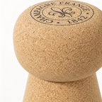 Macro detail of natural cork texture and engraved champagne-inspired top on Cork Stool