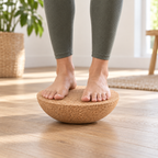 Cork Half-Moon Balance Board used with both feet on the flat top for balance training on a level floor