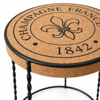 Macro detail of the natural cork tabletop, decorative top print and black metal rim