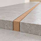 Cork strip installed between flooring sections as an expansion joint