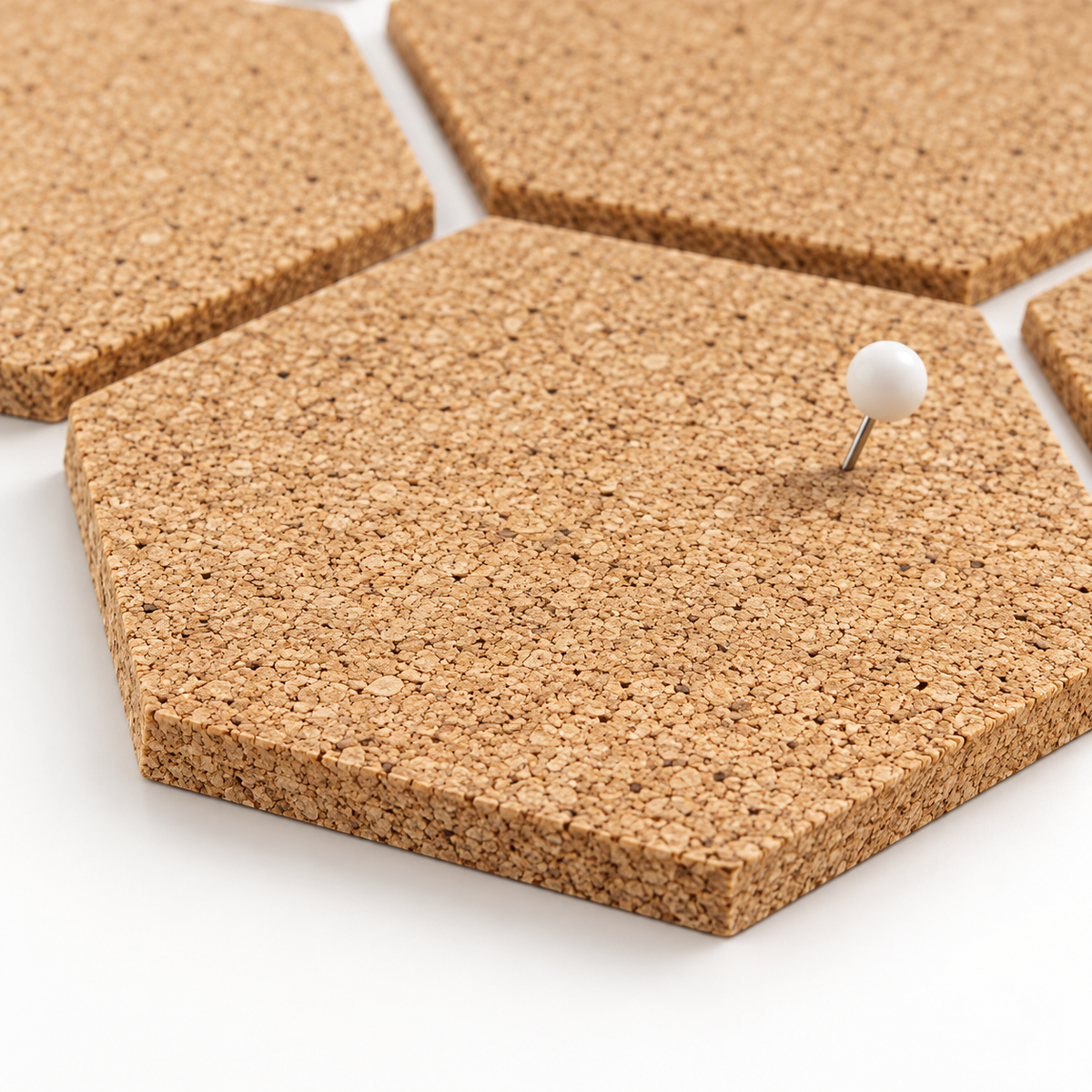 Macro detail of natural cork texture, 7 mm thickness and push pin use on a hexagon tile
