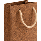 Cork Wine Bottle Gift Bag | Brown Finish — macro detail of brown cork-textured surface and cord handle