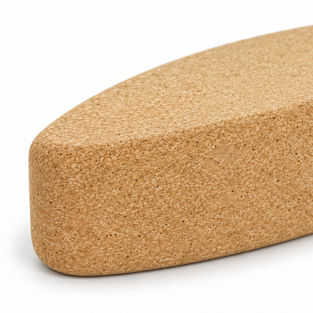 Macro detail of natural cork texture and rounded profile on Cork Yoga Egg Block
