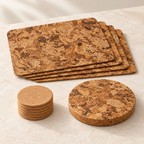 Studio angled view of four Angola cork placemats, six round natural coasters and one matching Angola round trivet
