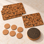 Studio angle view of 4 Fjord Black cork placemats, 6 natural cork coasters and one round dark cork trivet