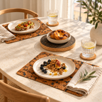 Fjord Black cork placemats with natural coasters and a round dark trivet at a sunny breakfast table