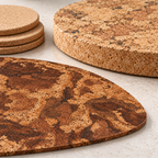 Macro of genuine dark marbled Angola cork placemat and pale 20mm thick Angola cork trivet