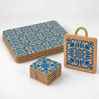Portuguese Tile table set studio photo: four stacked placemats, six stacked coasters and one thick blue-patterned trivet with natural rope loop