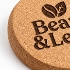 Custom Laser-Engraved Cork Coasters | 95 × 6 mm — macro cork texture and laser engraving detail