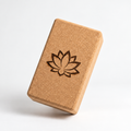 Custom laser engraved cork yoga block, main studio view with an example lotus design.
