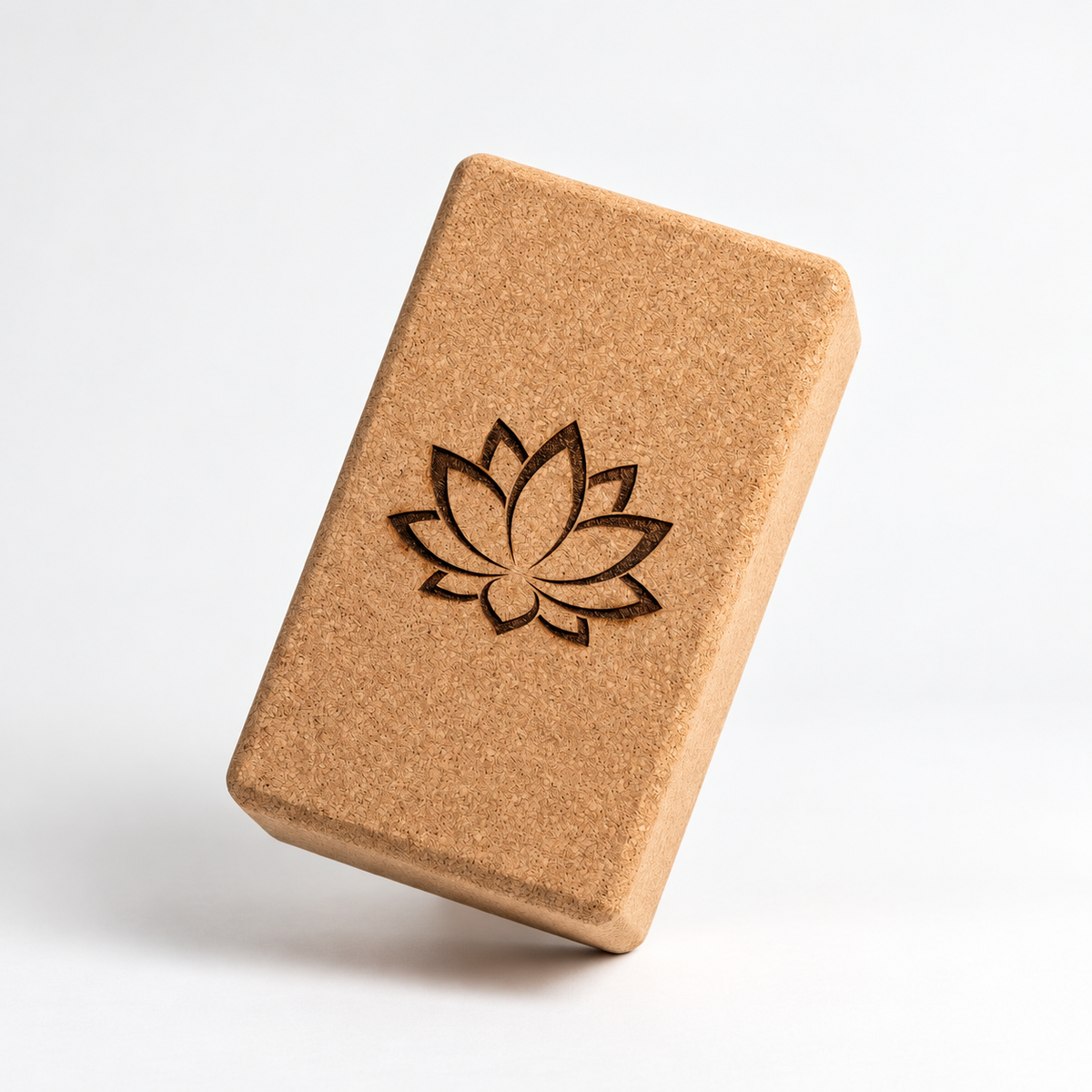 Custom laser engraved cork yoga block, main studio view with an example lotus design.