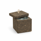 Dark square cork cooler with lid, angled studio view showing cube geometry, dark cork finish and metal interior