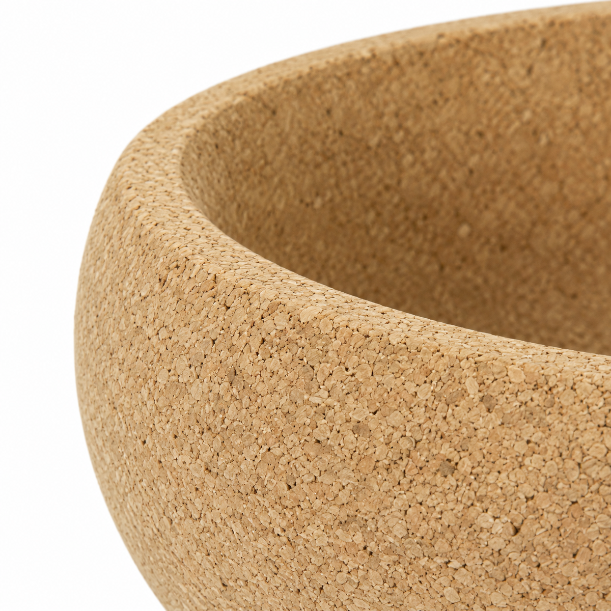 Macro detail of natural cork texture and rounded rim on deep fruit bowl