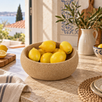 Deep cork fruit bowl filled with lemons in a Mediterranean kitchen setting