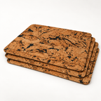 Stack of four Fjord Black cork placemats showing thin profile and rounded corners