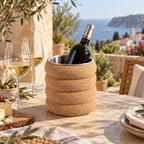 Fluted cork wine cooler with chilled bottle and glasses in a warm Mediterranean lifestyle setting