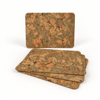 Stack of four Iceberg Green cork placemats showing thin profile and rounded corners