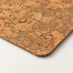 Macro close-up of Iceberg Grey cork placemat surface, rounded corner and thin edge