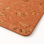 Macro close-up of Iceberg Red cork placemat surface, rounded corner and thin edge