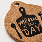Close-up of Kitchen Quote Cork Trivet natural cork texture and printed design