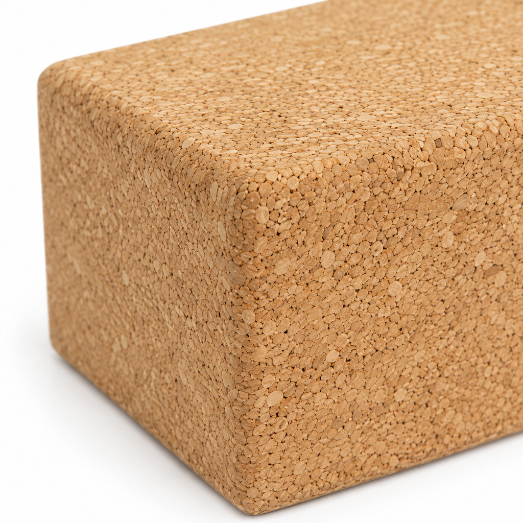 Macro detail of natural cork texture and rounded edge on large cork yoga block