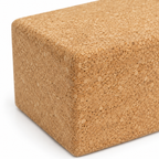 Macro detail of natural cork texture and rounded edge on large cork yoga block