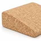 Macro detail of natural cork texture and tapered edge on mini cork yoga wedge