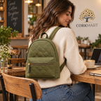 Piccola Green Cork Backpack in a cafe and workspace setting