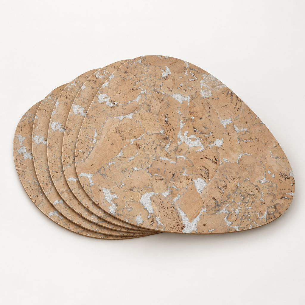 Stack of Pick Snow White cork placemats showing the organic teardrop profile