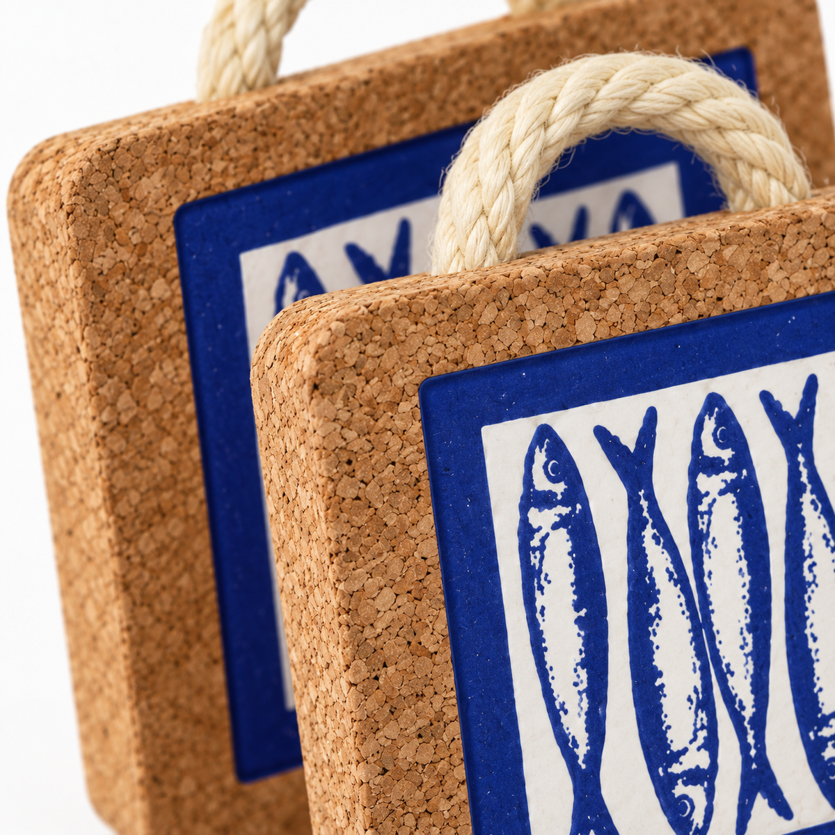 Close-up of Portuguese Sardine Tile Cork Trivet cork texture, rope and blue sardine print