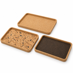 Rectangular cork serving tray in Natural, Fjord Black and Dark finishes, angled studio view