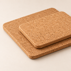Macro close-up of the two rectangular natural cork trivets with rounded corners and 9 mm profile