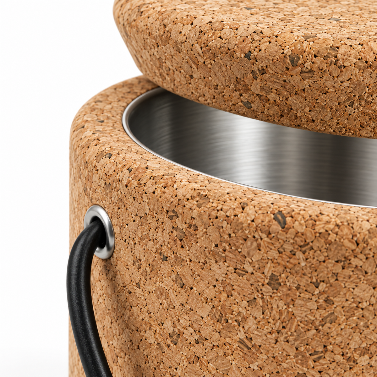 Macro detail of natural cork texture, stainless-steel interior and cord eyelet on round cork ice bucket