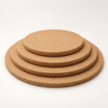 Round cork trivet, 9 mm, available in Ø150, Ø200, Ø245 and Ø300 mm — premium studio hero